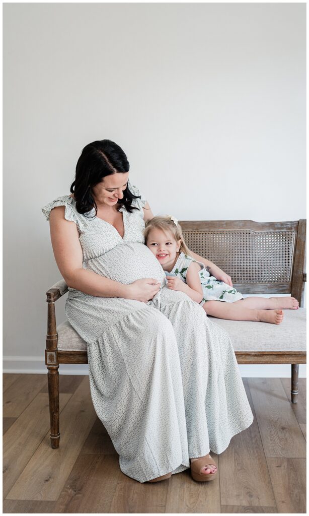 A Studio Maternity Session child laughing 